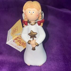 Gilde Angel and Ornaments. Item no: 28047. Girl standing holding star.